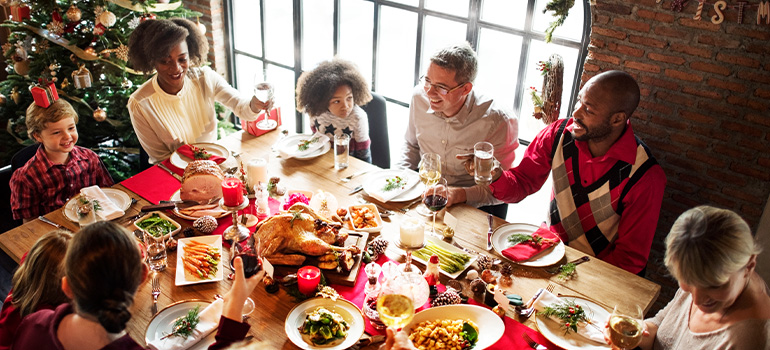 Family and friends gathering around for holiday dinner and drinks
